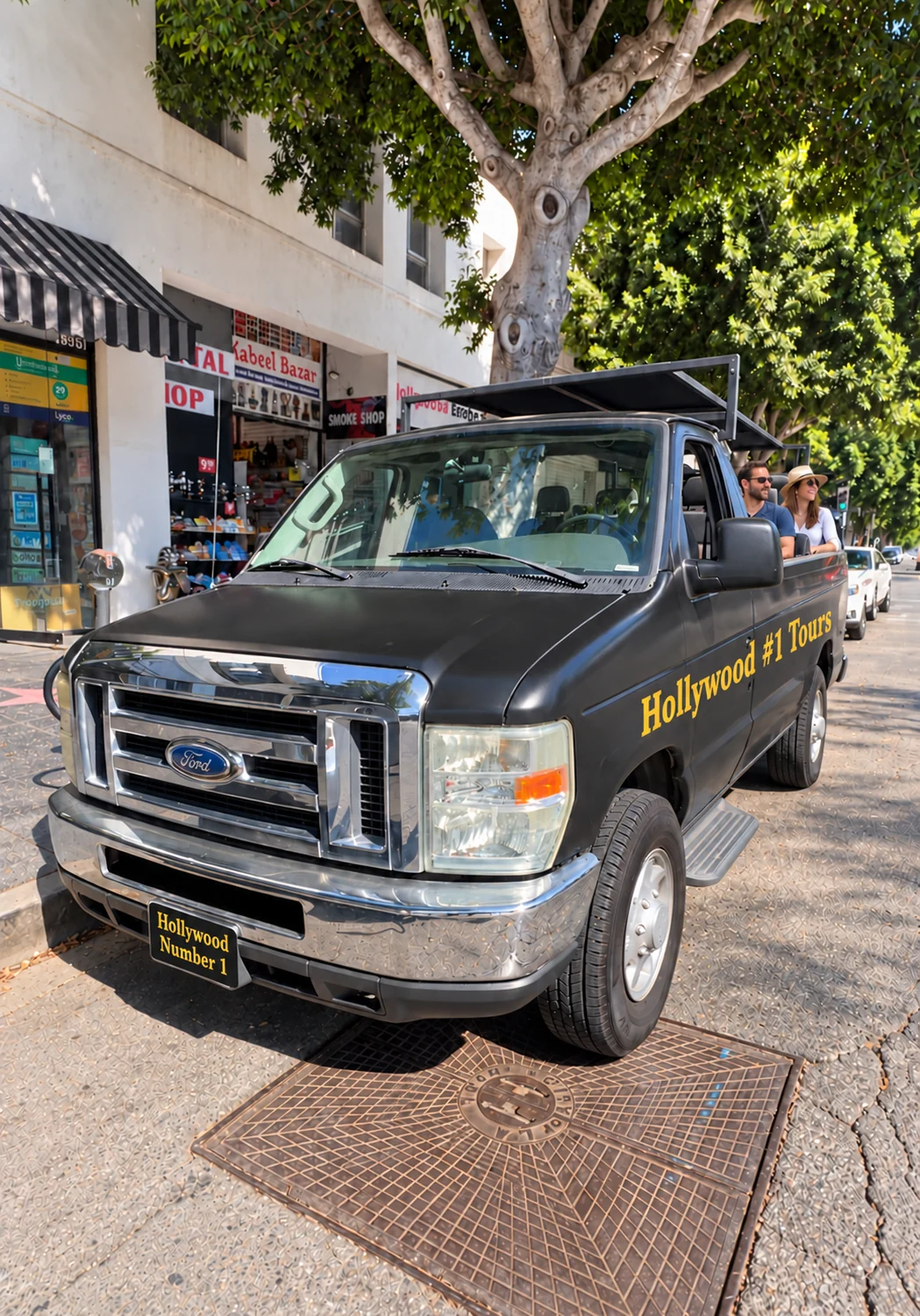 Front view of the business’s sightseeing van, with digitally added branding and fictional passengers